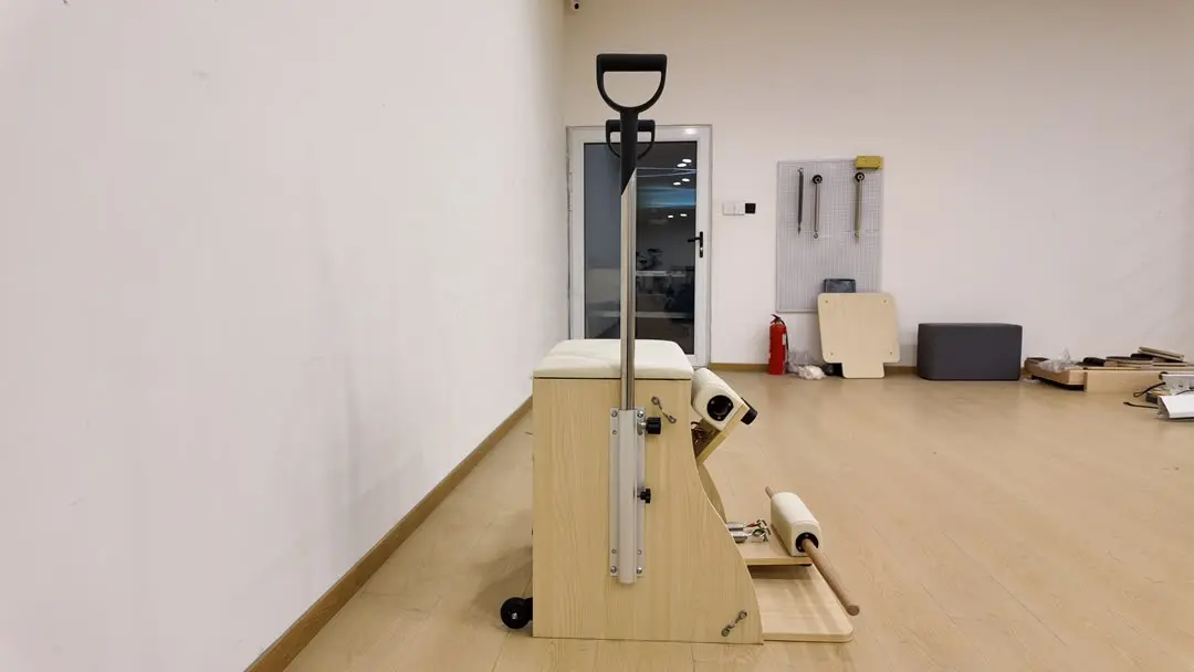 Oak Pilates Chair in a client studio